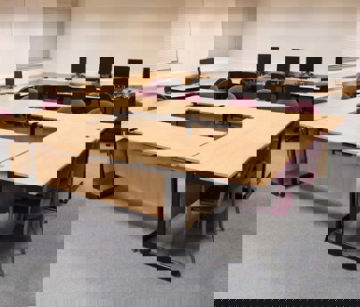 Training room with tables, chairs and computers