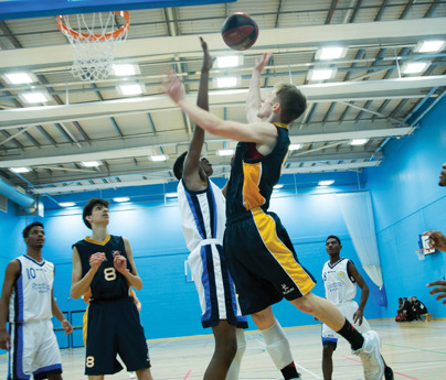 people playing basketball in sports hall