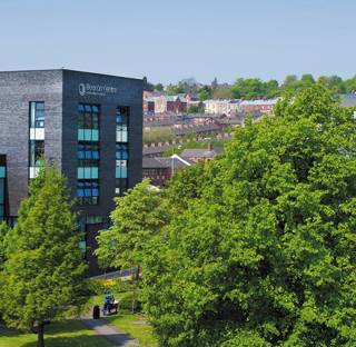 Blackburn College campus with Beacon Centre, University Centre and large leafy trees