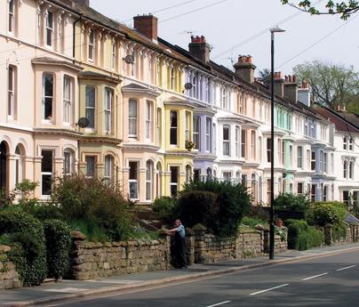 street of houses with gardens in uk